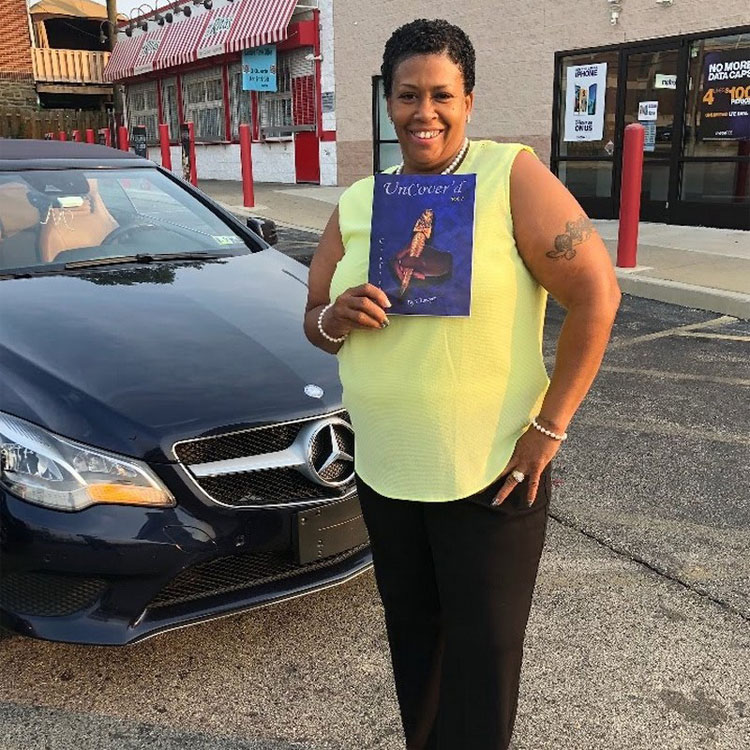 customer holding the book of poetry